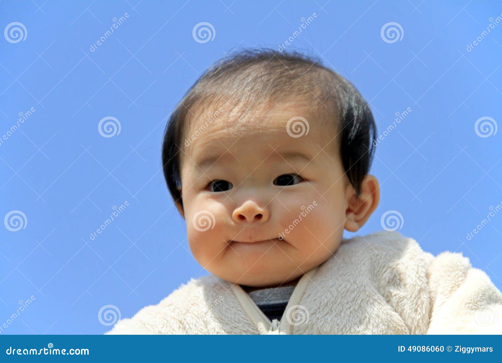 Baby boy under blue sky stock photo. Image of human, zero 49086060