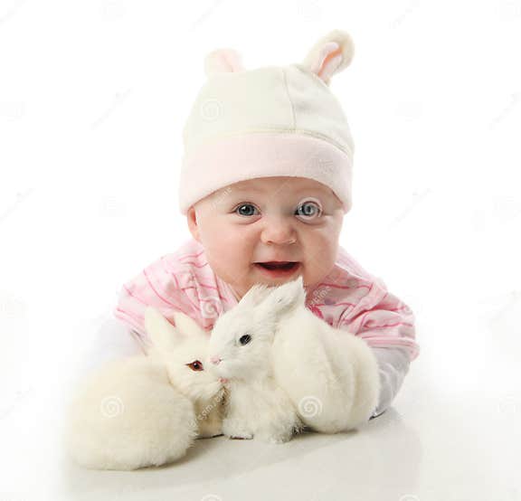 Baby and bunnies stock photo. Image of ball, hand, ears 17892106