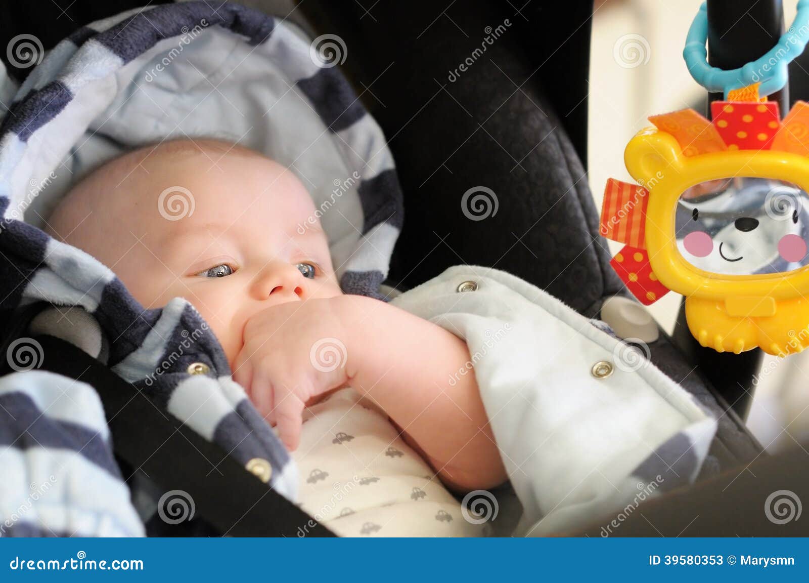 Baby in car seat stock image. Image of human, plaything 39580353