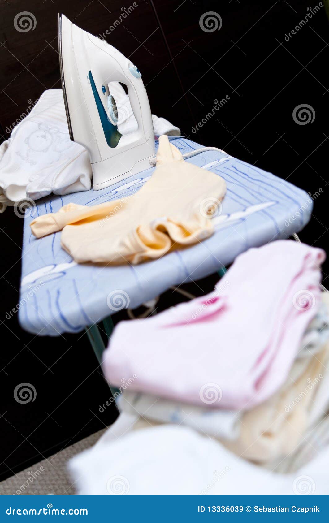 Baby clothes ironing stock image. Image of garment, board 13336039