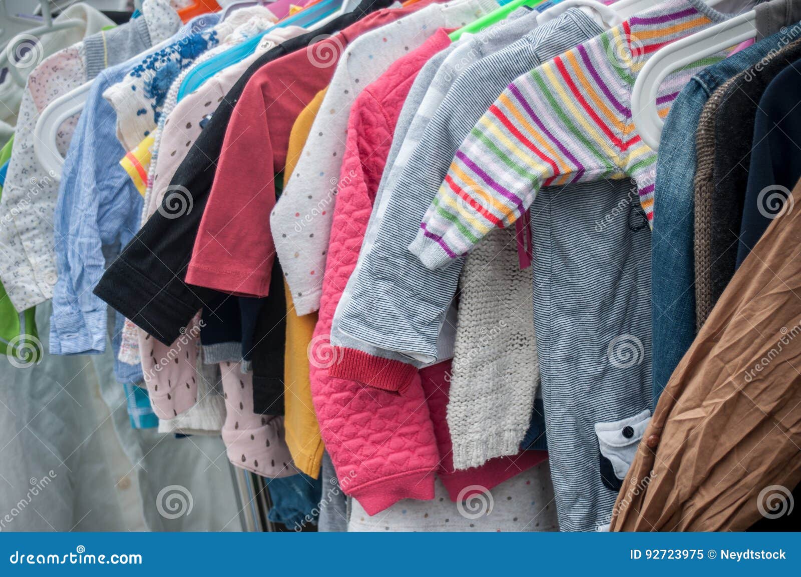 Baby Clothes on Rack in a Flea Market Stock Image Image of knitted