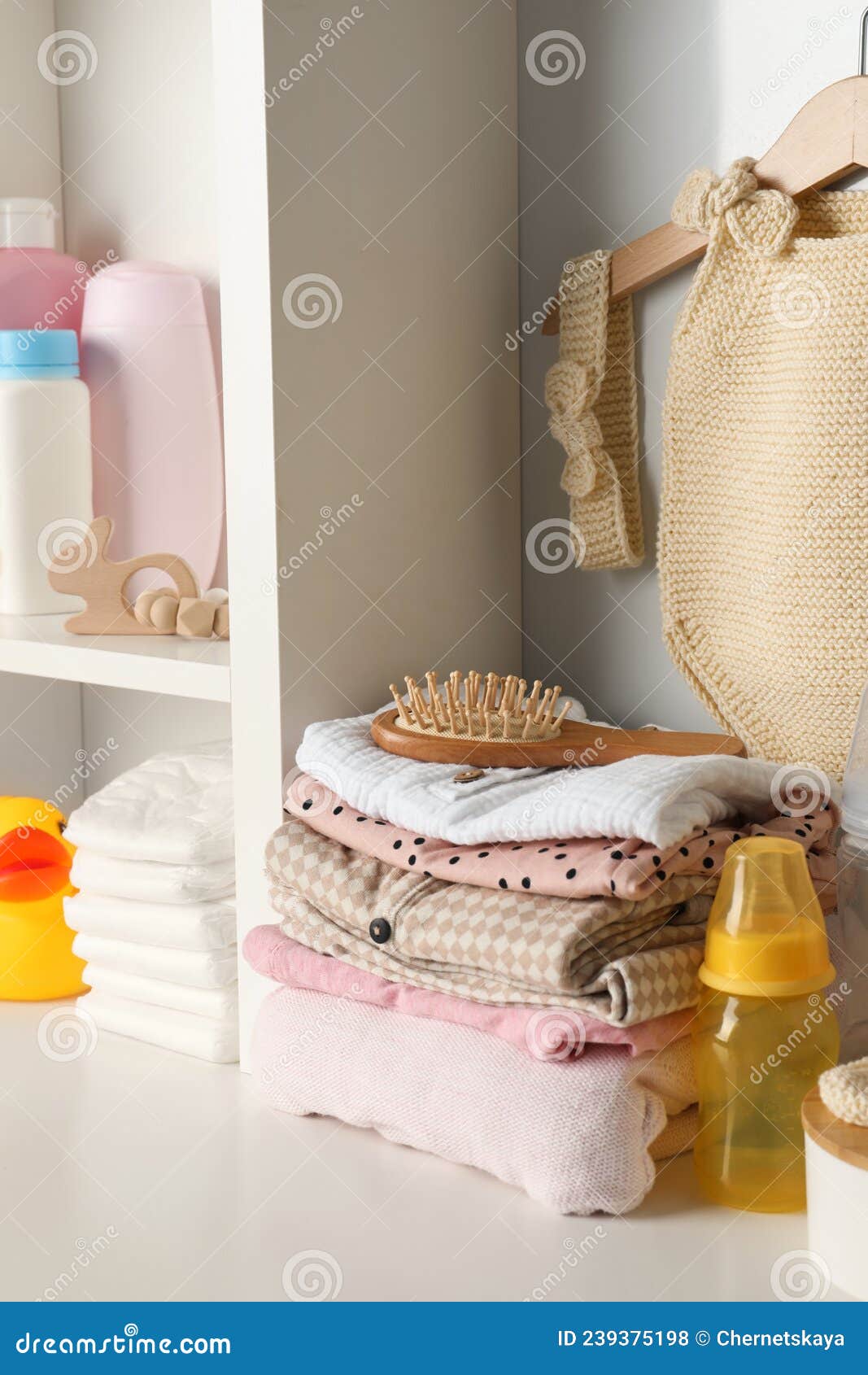 Baby Clothes, Toy and Accessories on White Rack Stock Photo Image of diapers, background