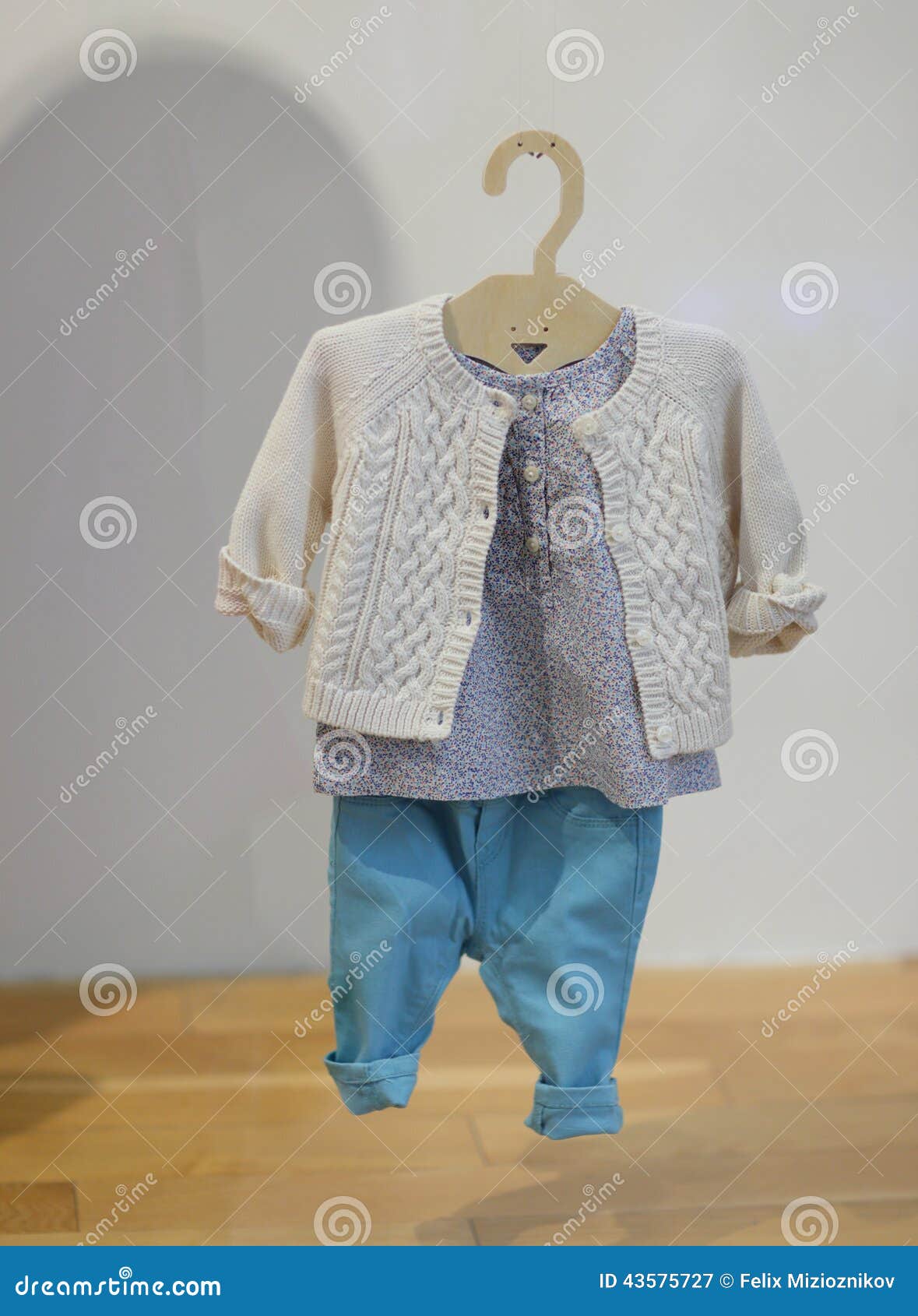 Baby clothing on a hanger stock image. Image of hanging 43575727