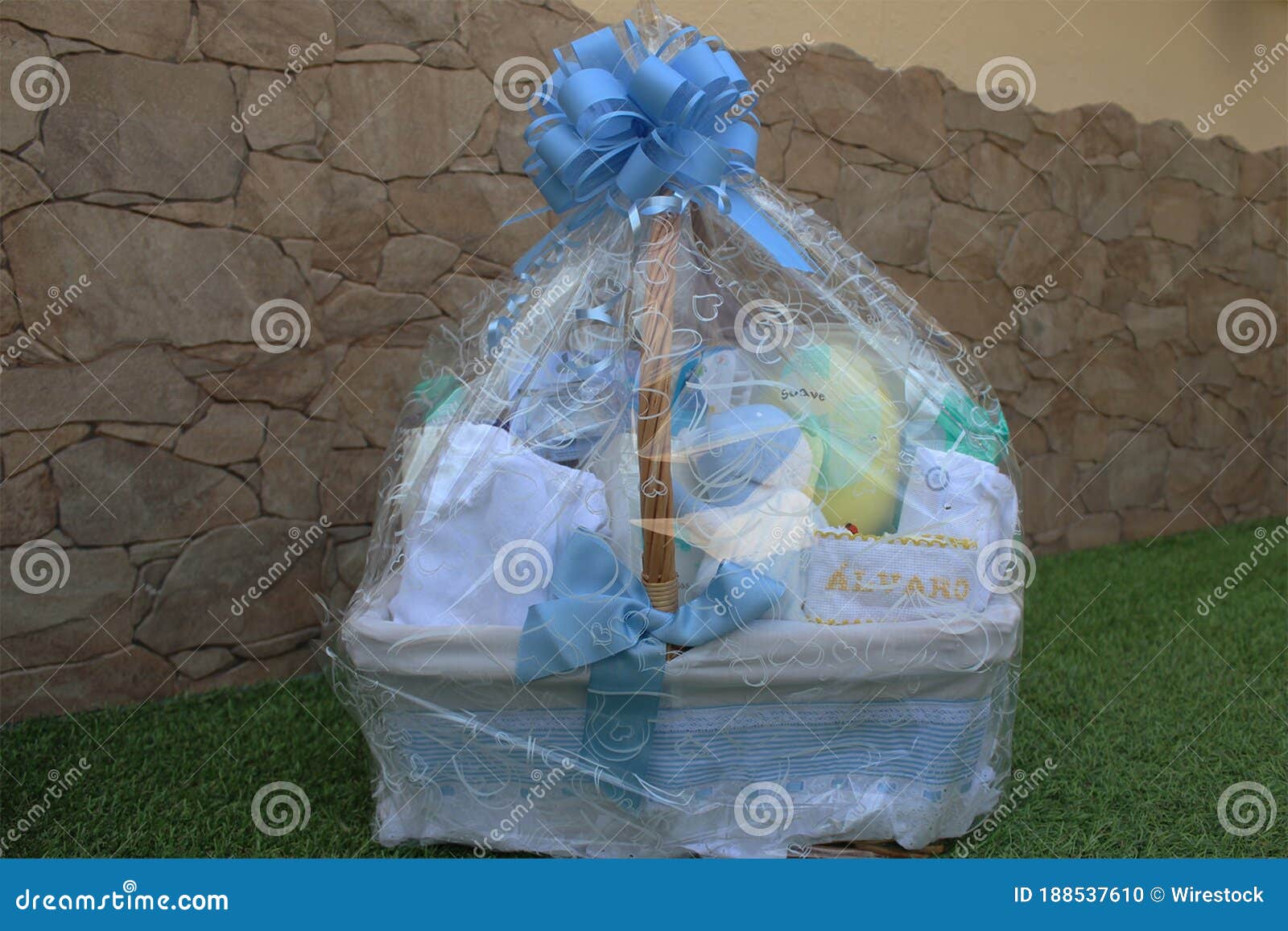 baby cradle wrapped in a plastic gift bag with a nametag alvaro on it