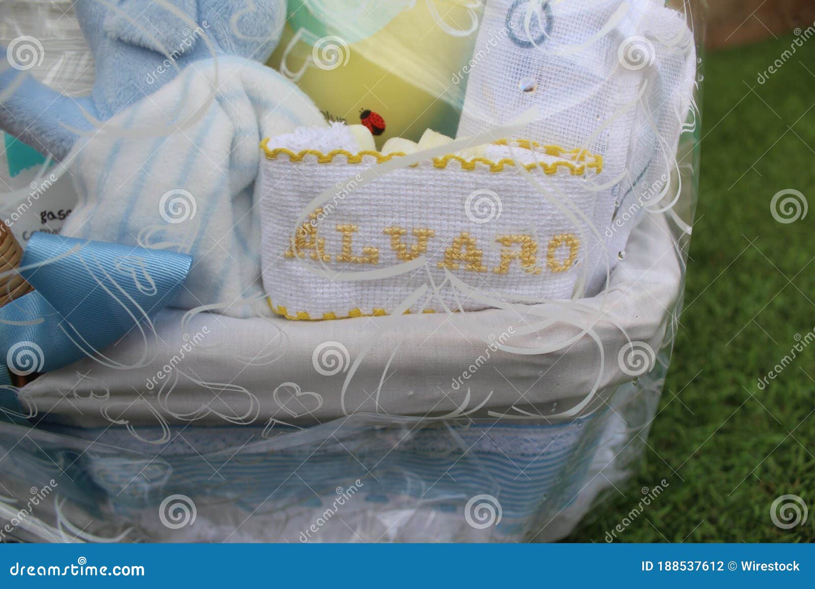 baby cradle wrapped in a plastic gift bag with a nametag alvaro on it