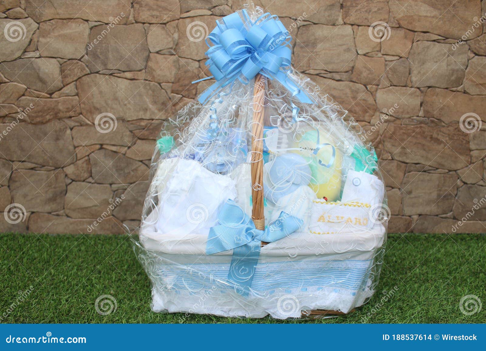 baby cradle wrapped in a plastic gift bag with a nametag alvaro on it