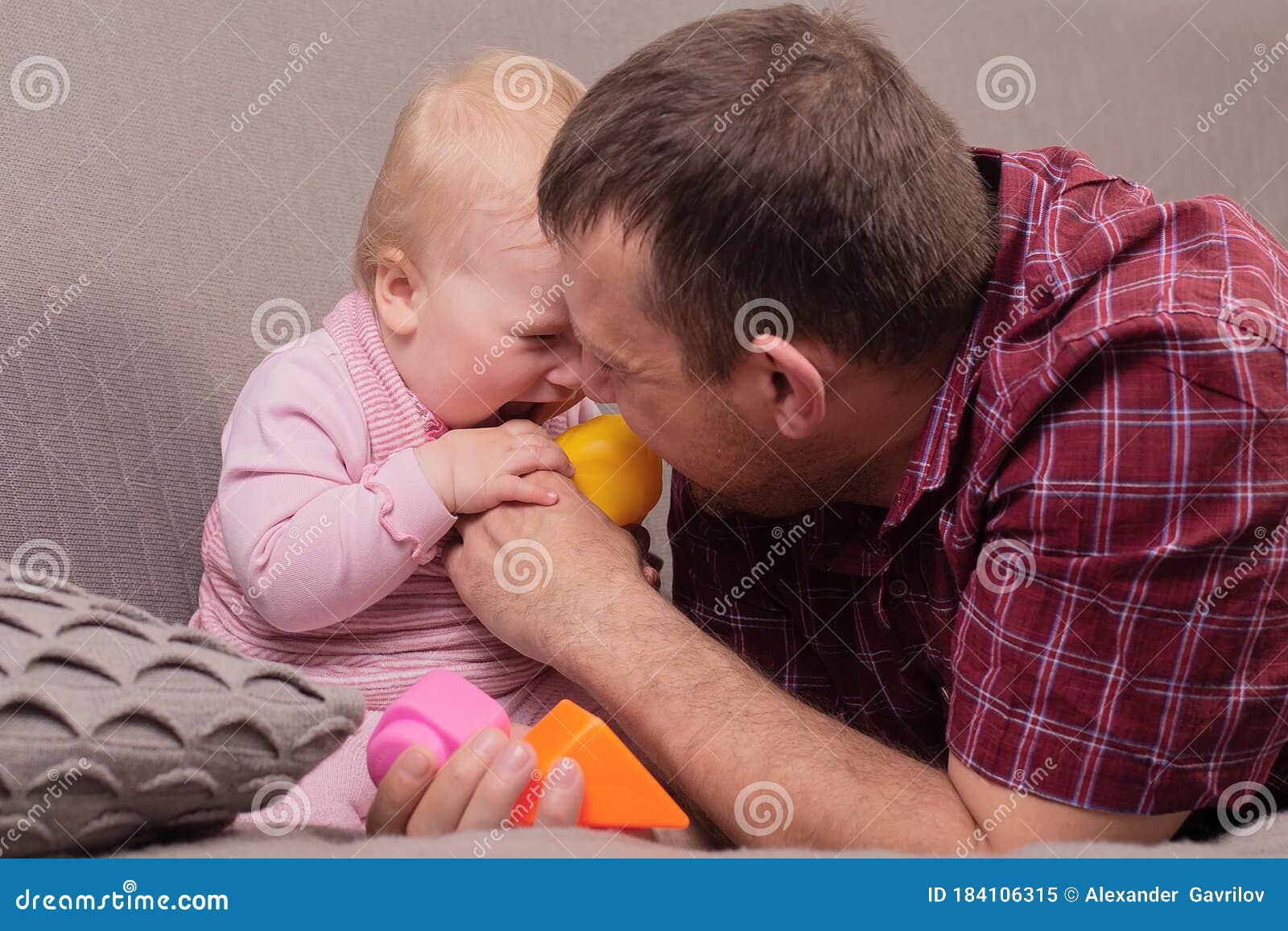 Baby And Daddy Dream Of A Pilot. Child Sits On Father`s Neck
