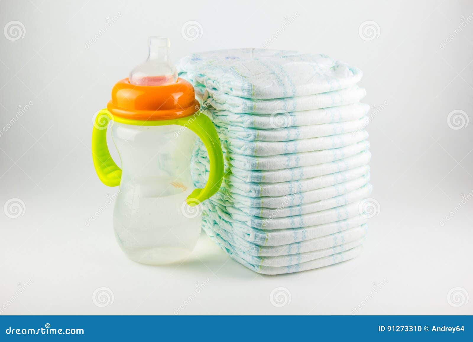Baby Diapers and Bottle on a White Background Stock Photo - Image of ...