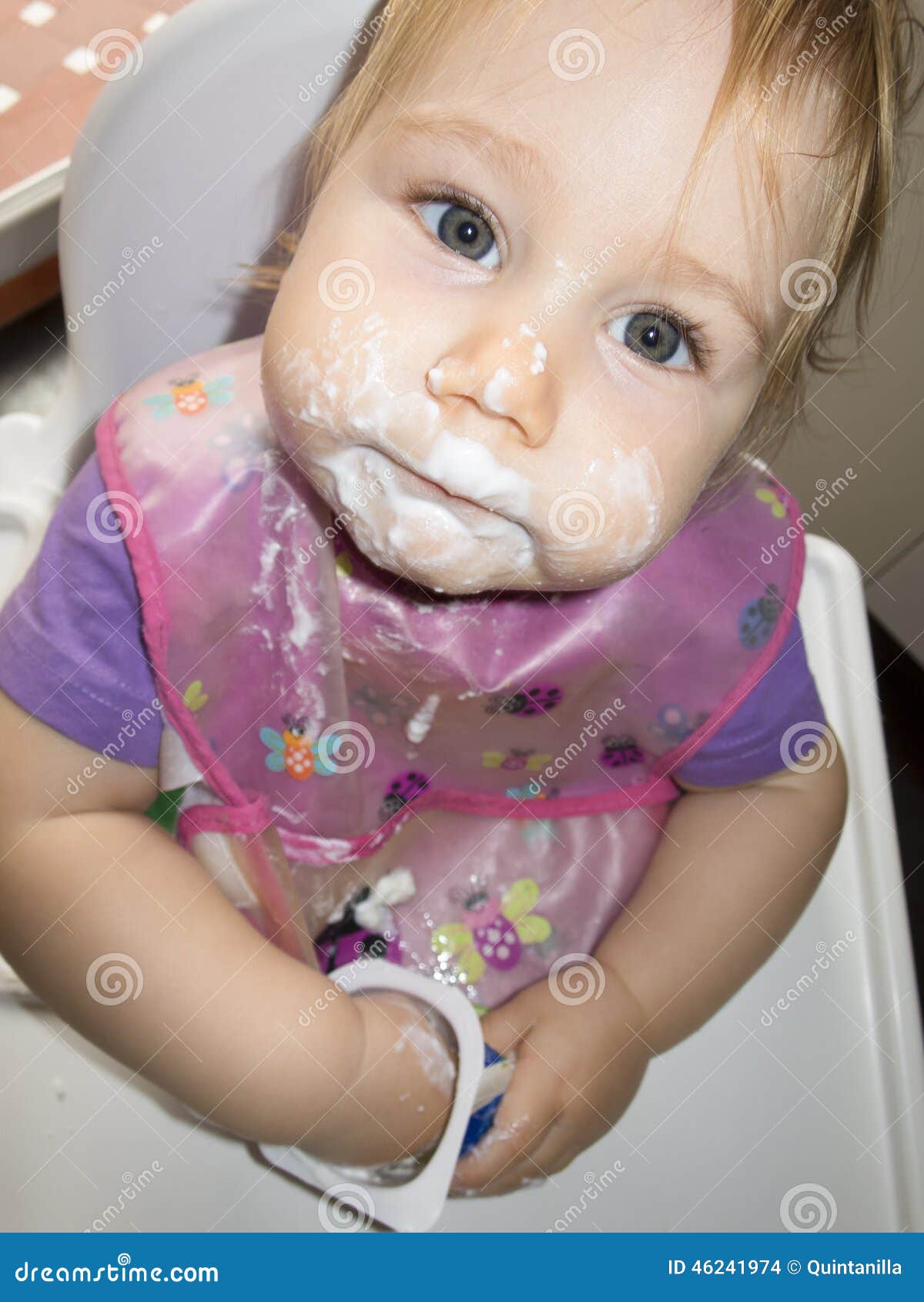 Baby Dirty Face White Yogurt In High-chair Stock Photo ...