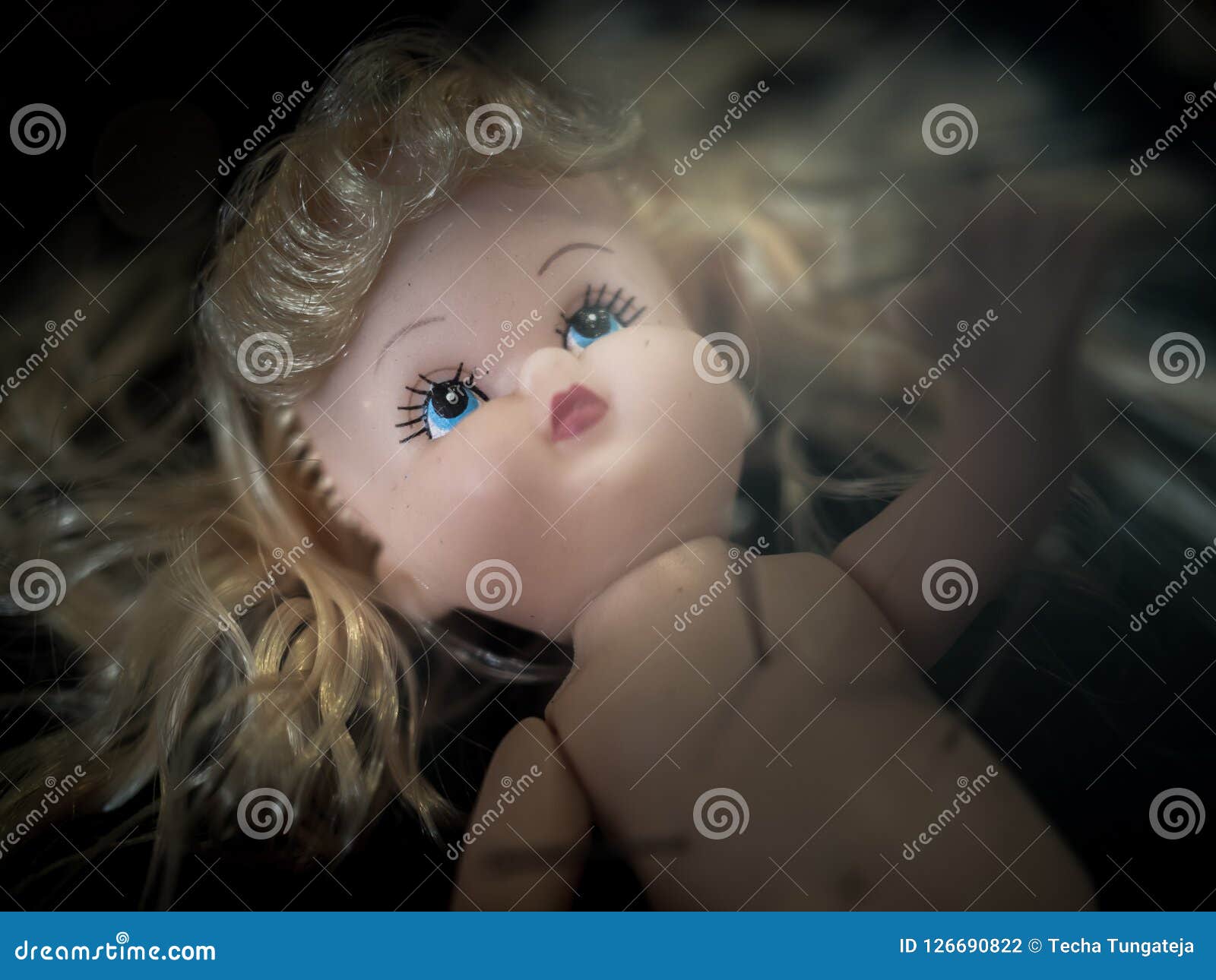 creepy blonde doll