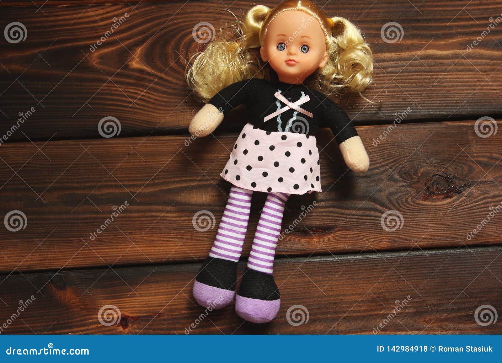 Baby Doll on Wooden Background. Stock Photo Image of design, hair