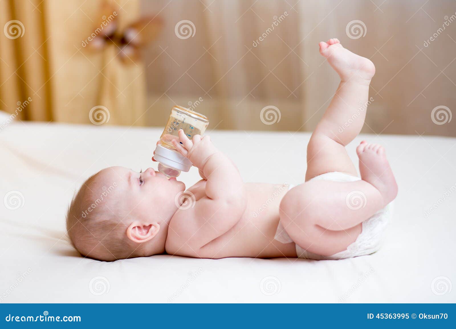 baby drinking water from bottle