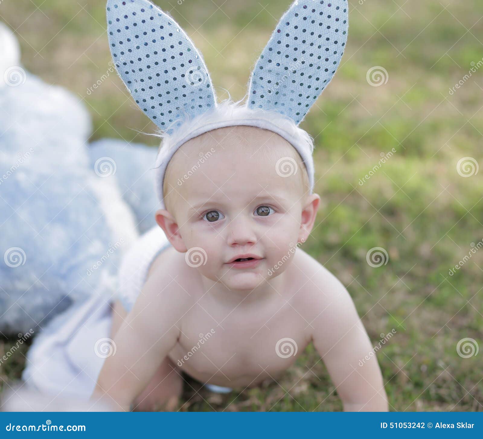 Baby during Easter with Bunny Ears Stock Photo Image of grass