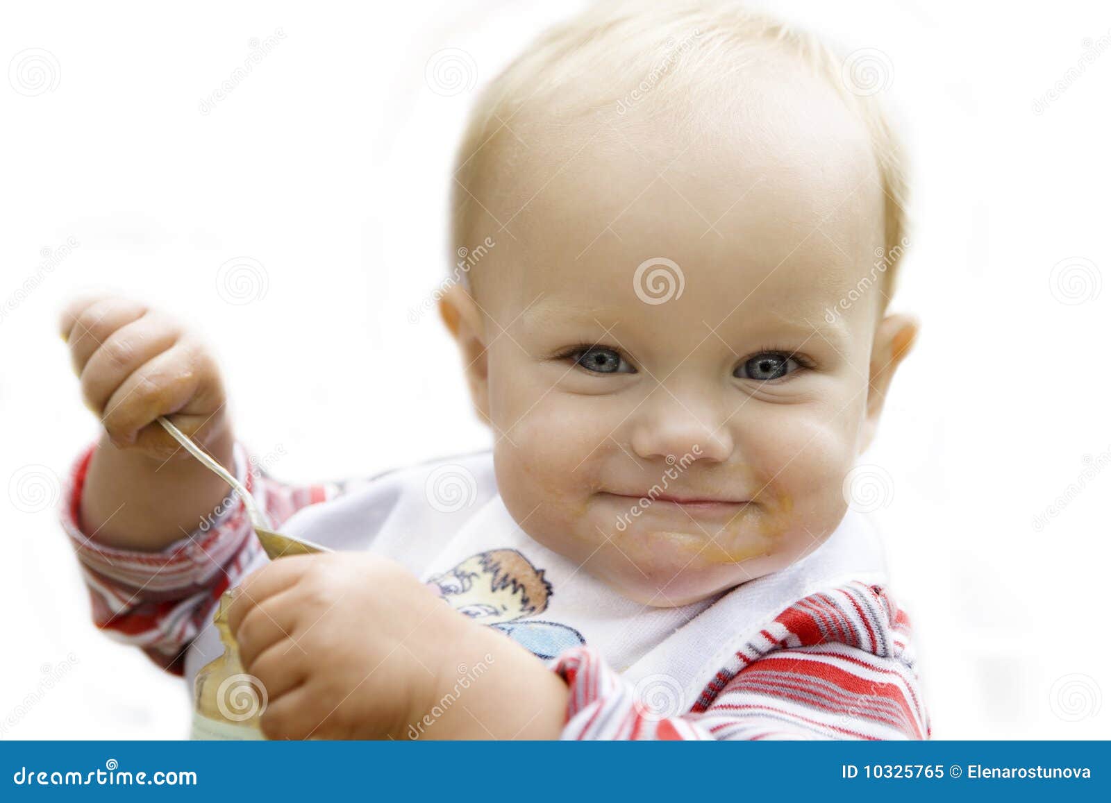 Baby Eating Apple Sauce with a Spoon Isolated in W Stock Image Image