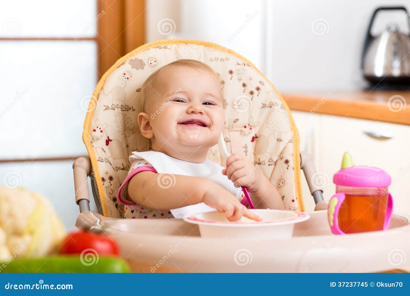 Baby Eating Healthy Food On Kitchen Stock Image - Image of cute