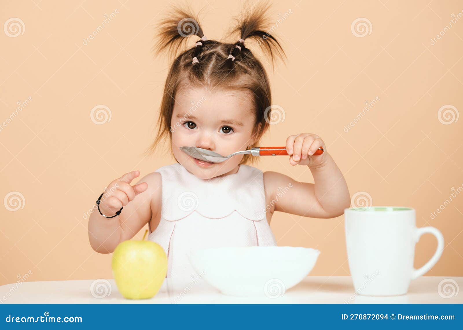 Baby Eating Kids Food Kid Eating Healthy Food With A Spoon At Studio Isolated Funny Kids Face food-for-kids-to-eat