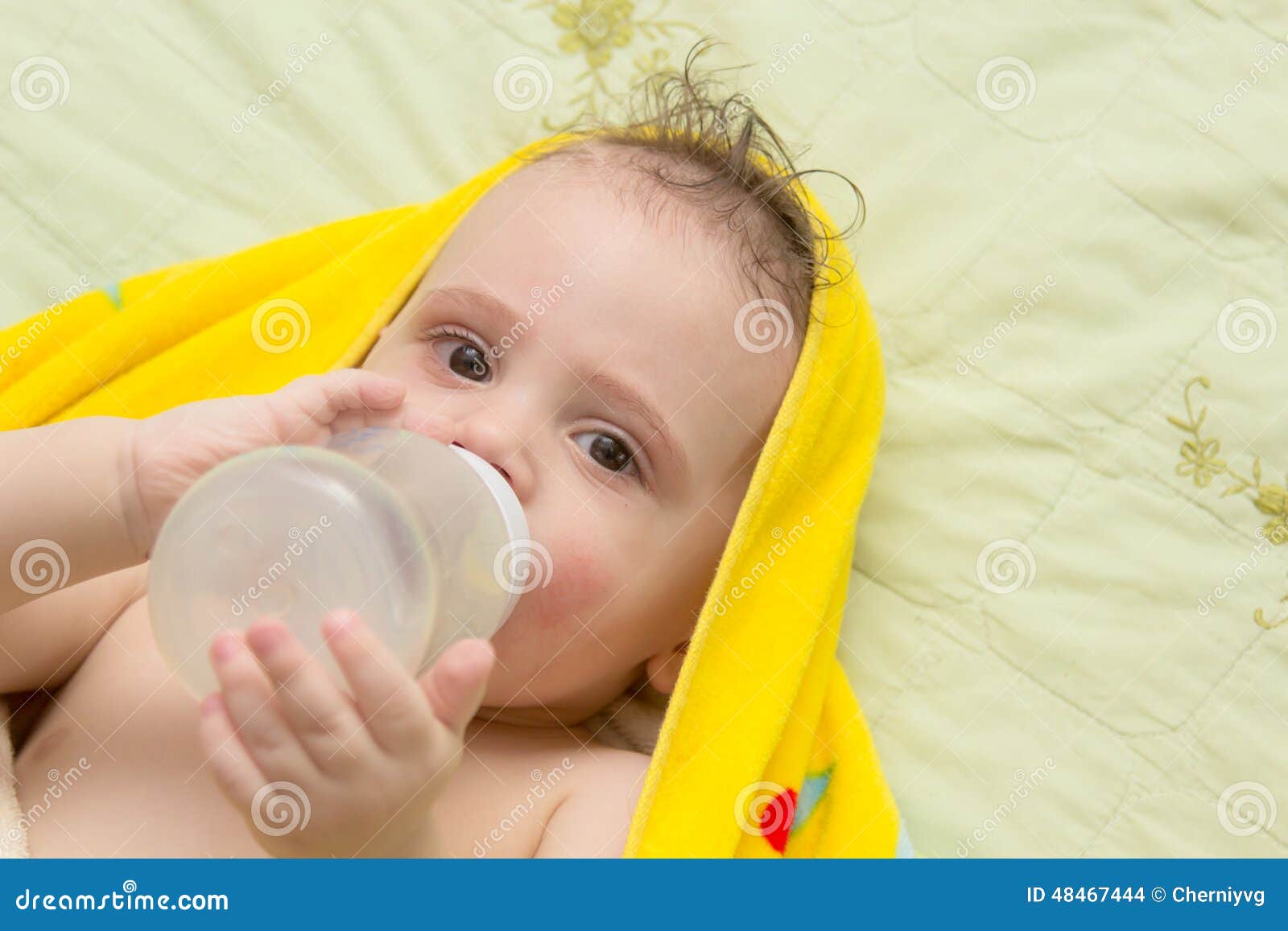 Baby eats from a bottle stock photo. Image of food, background 48467444