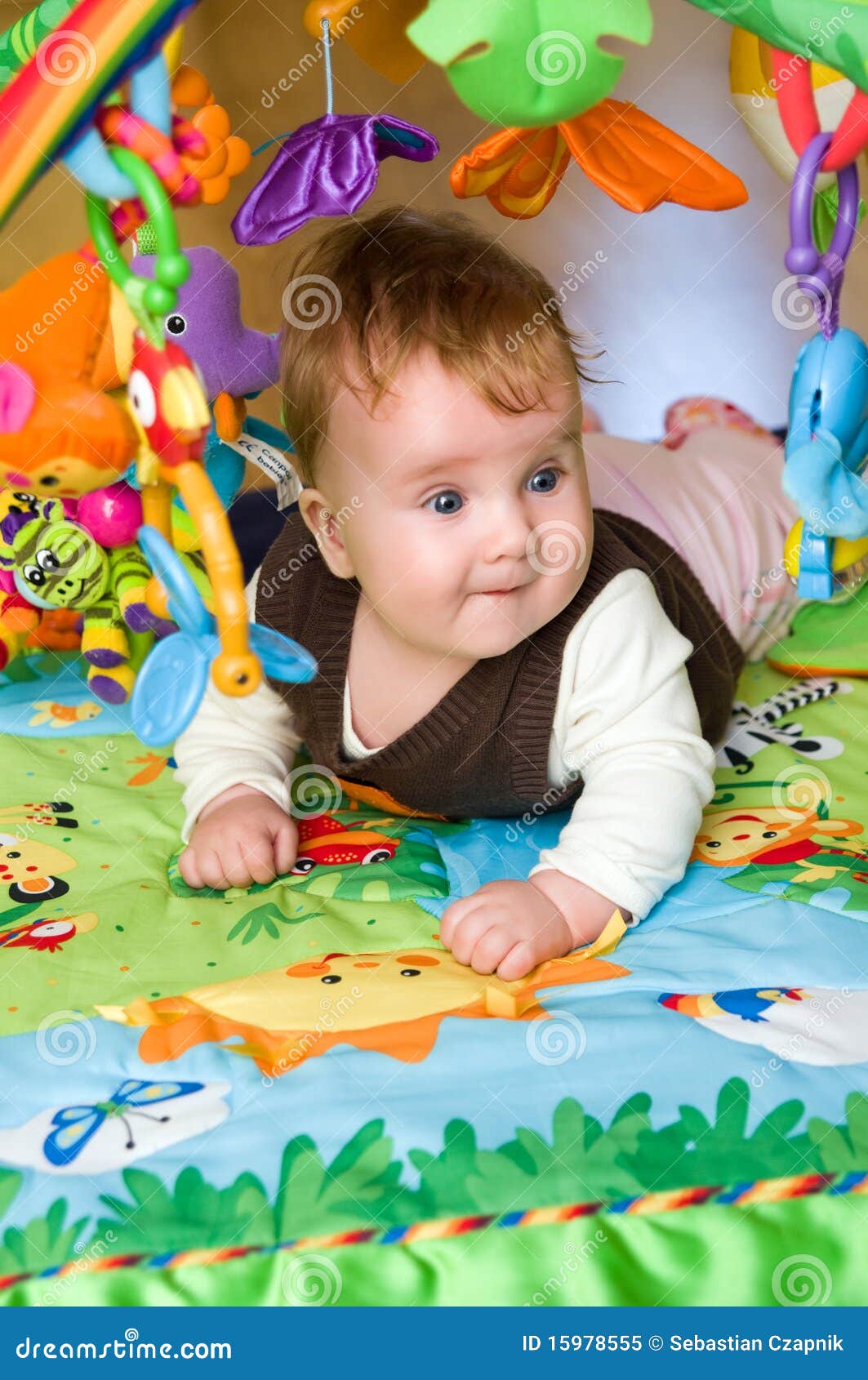 Baby in educational mat stock image. Image of explore 15978555