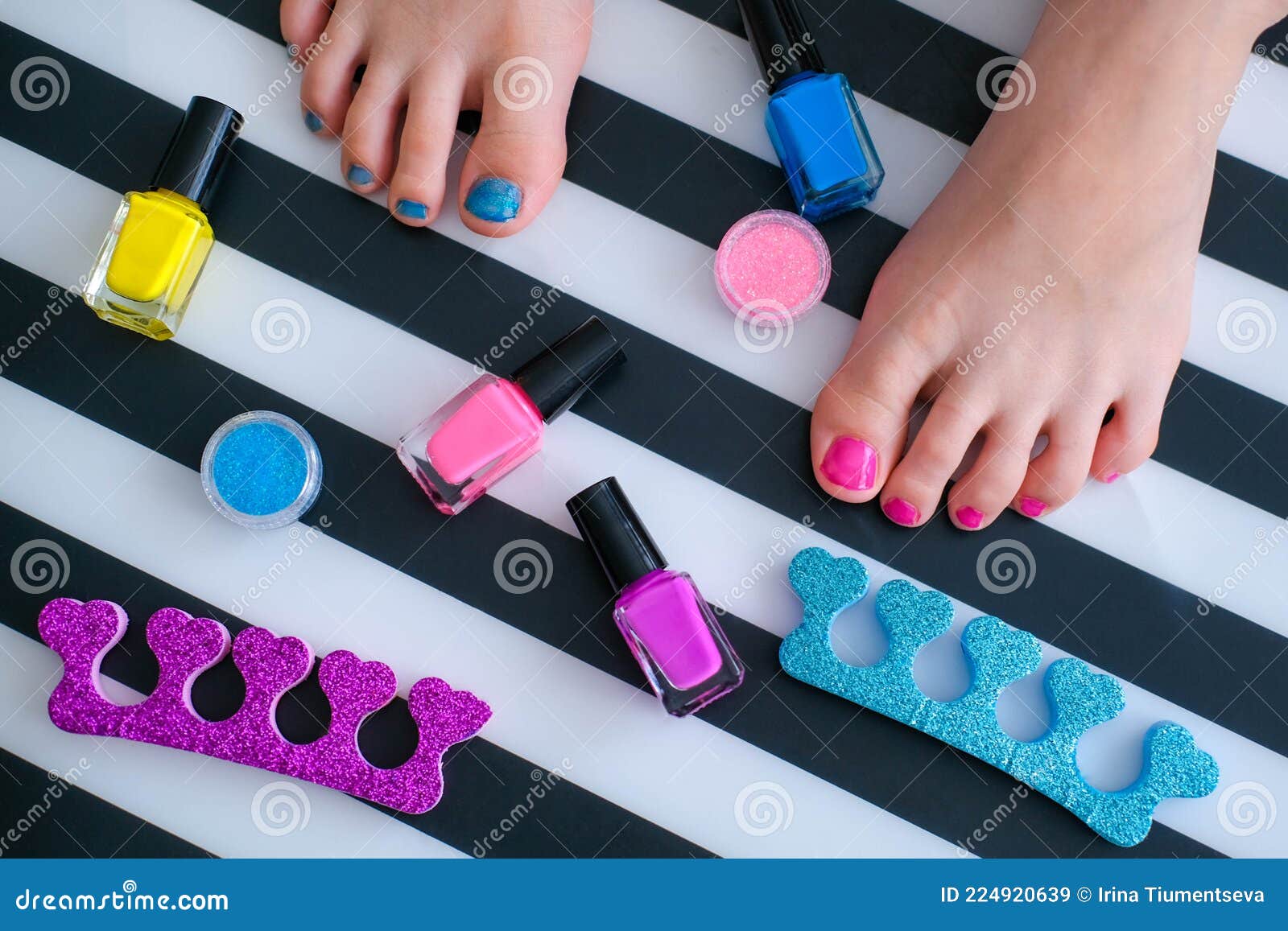 Baby Feet with Bright Pedicure of Different Colors and Bottles of Bright Nail  Polish. Little Girl Does a Pedicure Stock Image - Image of cute, indoors:  224920639
