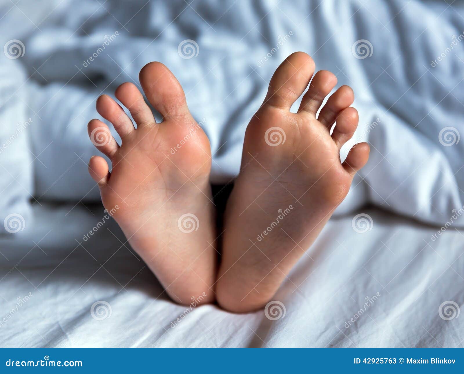 Baby feet under blanket stock image. Image of closeup - 42925763