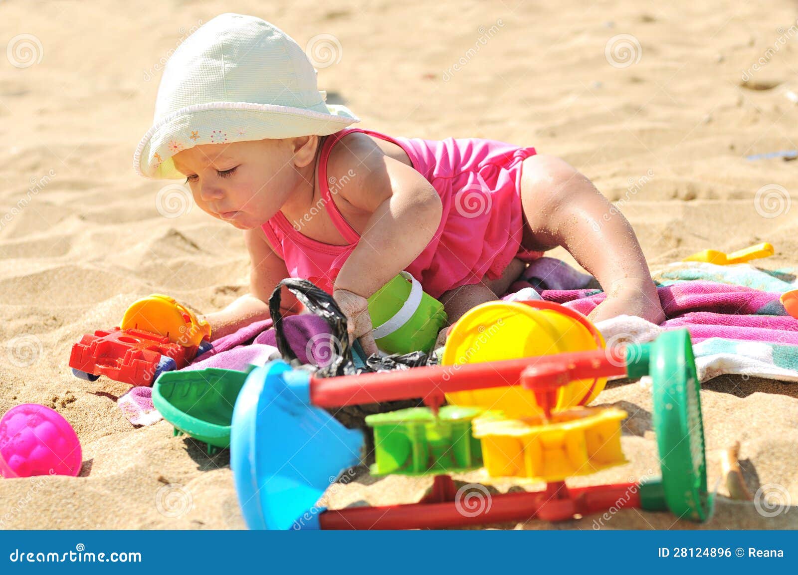 Baby girl on the beach stock photo. Image of cute, playing 28124896
