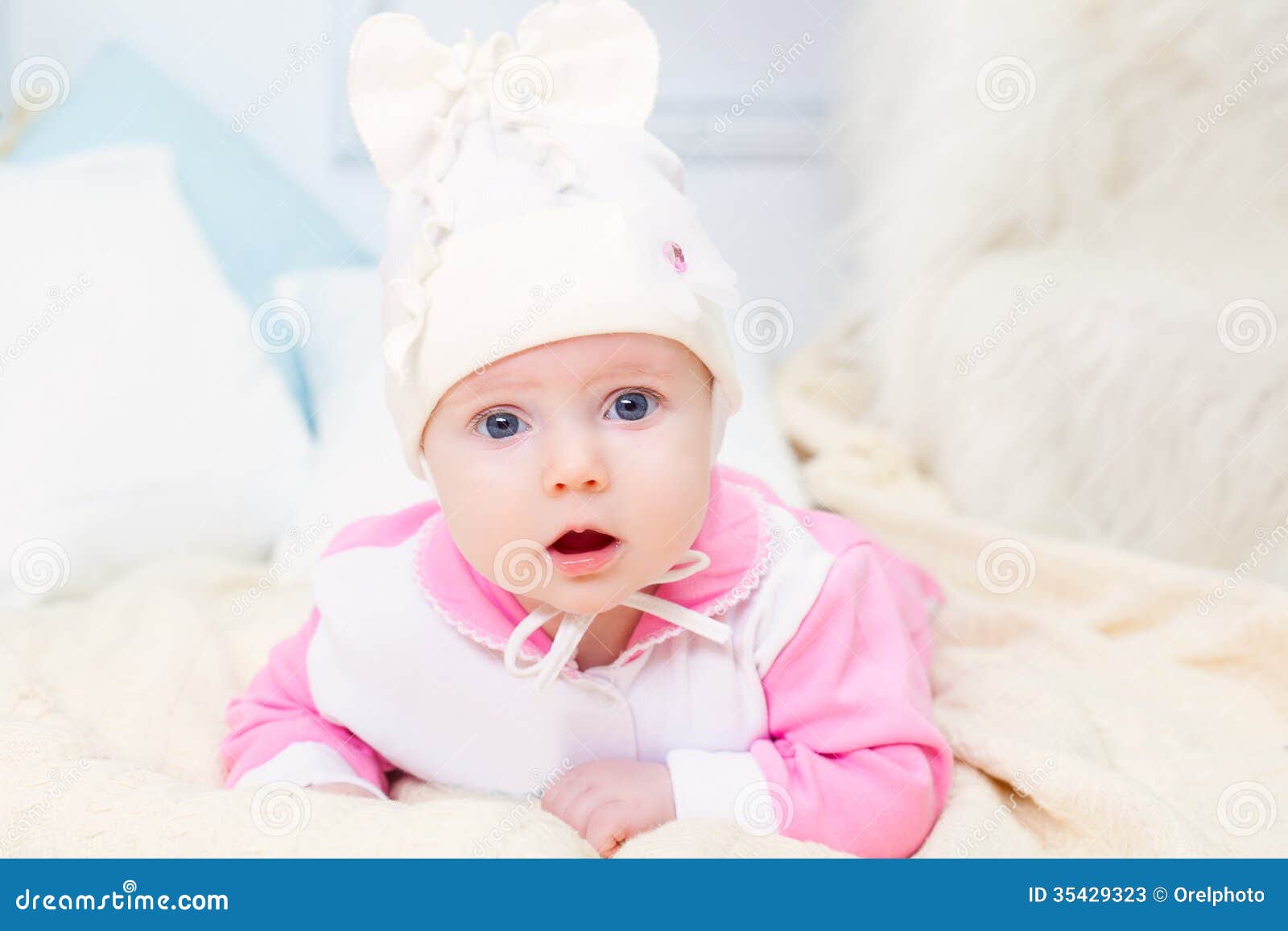 Baby girl in on the bed stock image. Image of cheerful 35429323