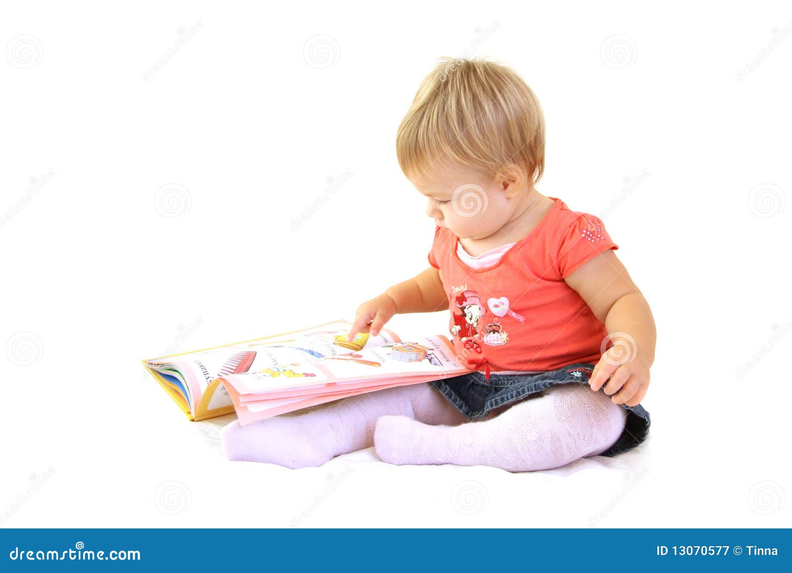 Baby girl with book stock image. Image of cute, joyful 13070577