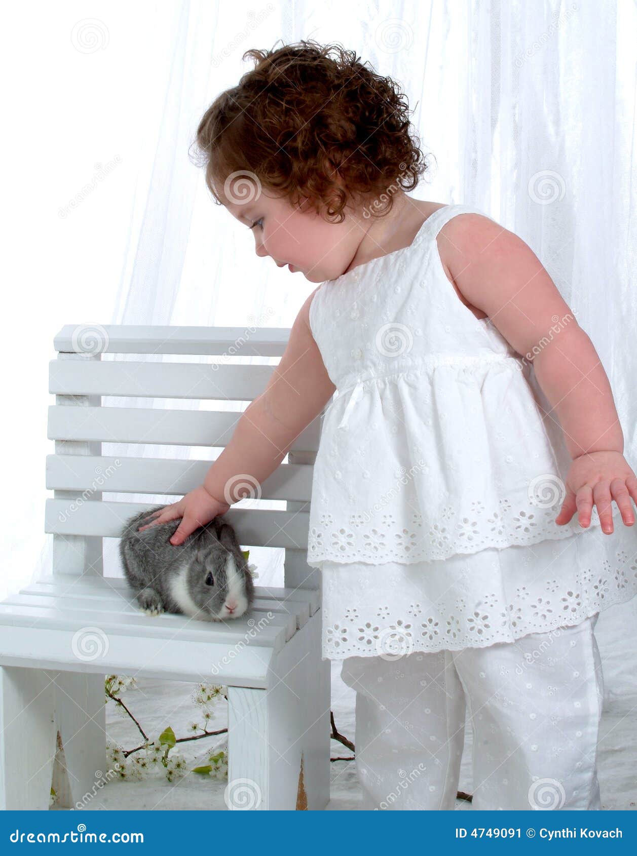 Baby Girl with Bunny stock image. Image of children, petting 4749091