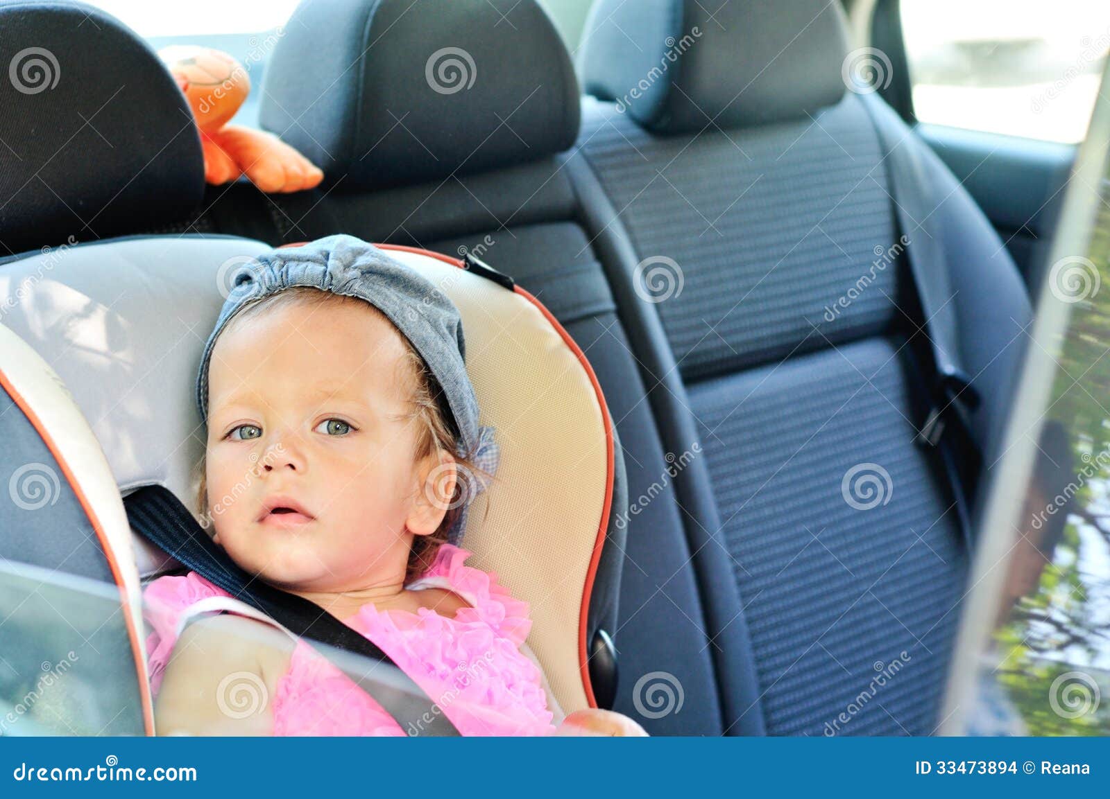 Baby girl in car stock photo. Image of hand, infant, child 33473894