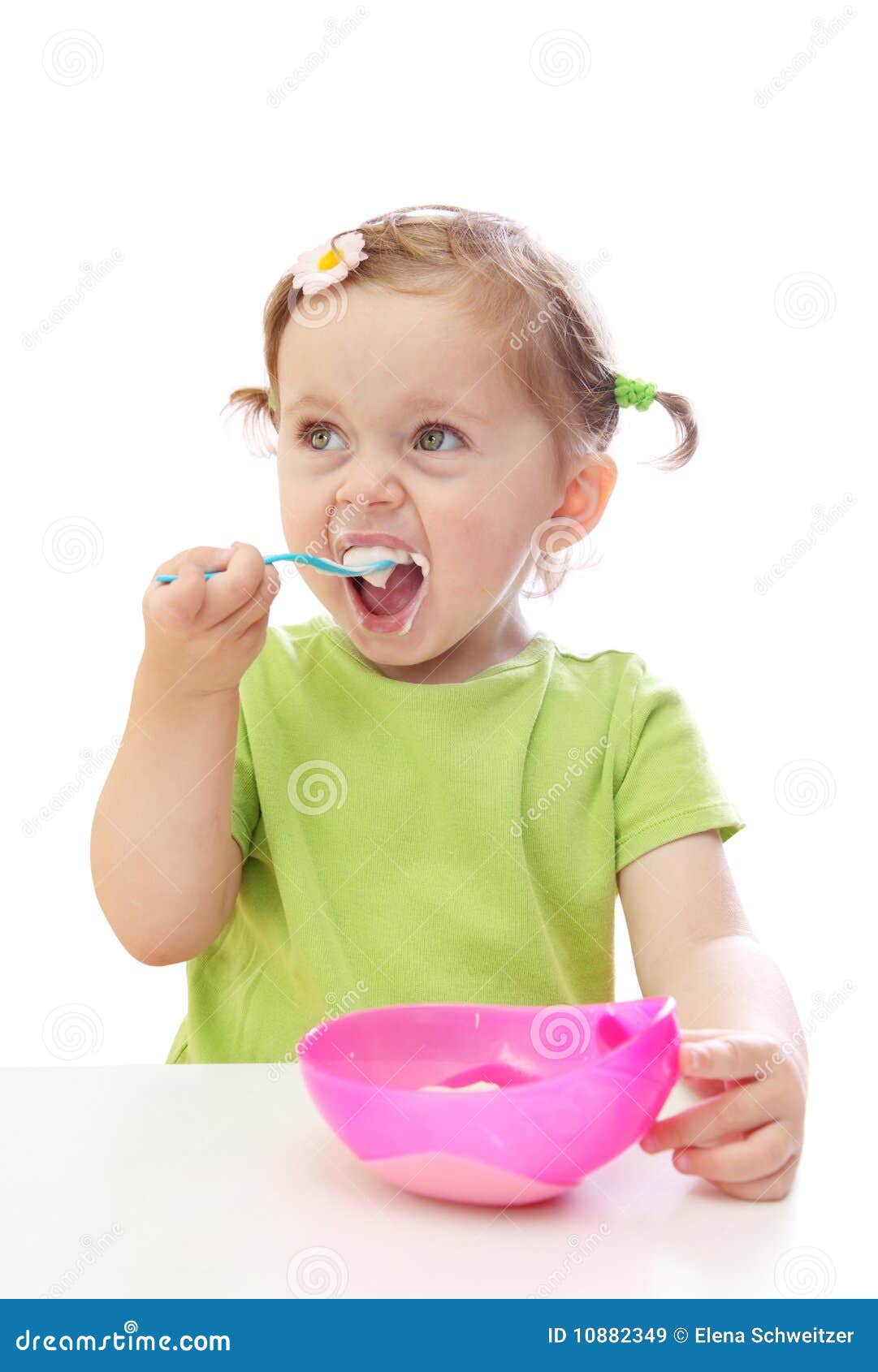 Baby girl eating yoghurt stock image. Image of dairy 10882349
