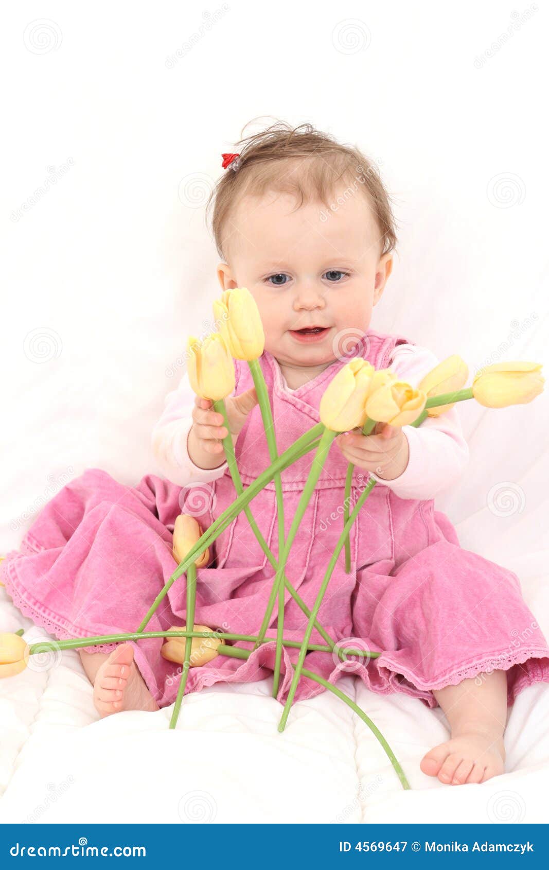Baby girl with flowers stock image. Image of girl, smiling 4569647