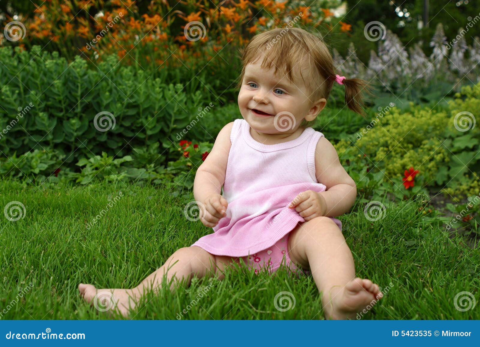 Baby-girl iin a pink dress stock image. Image of crawling - 5423535