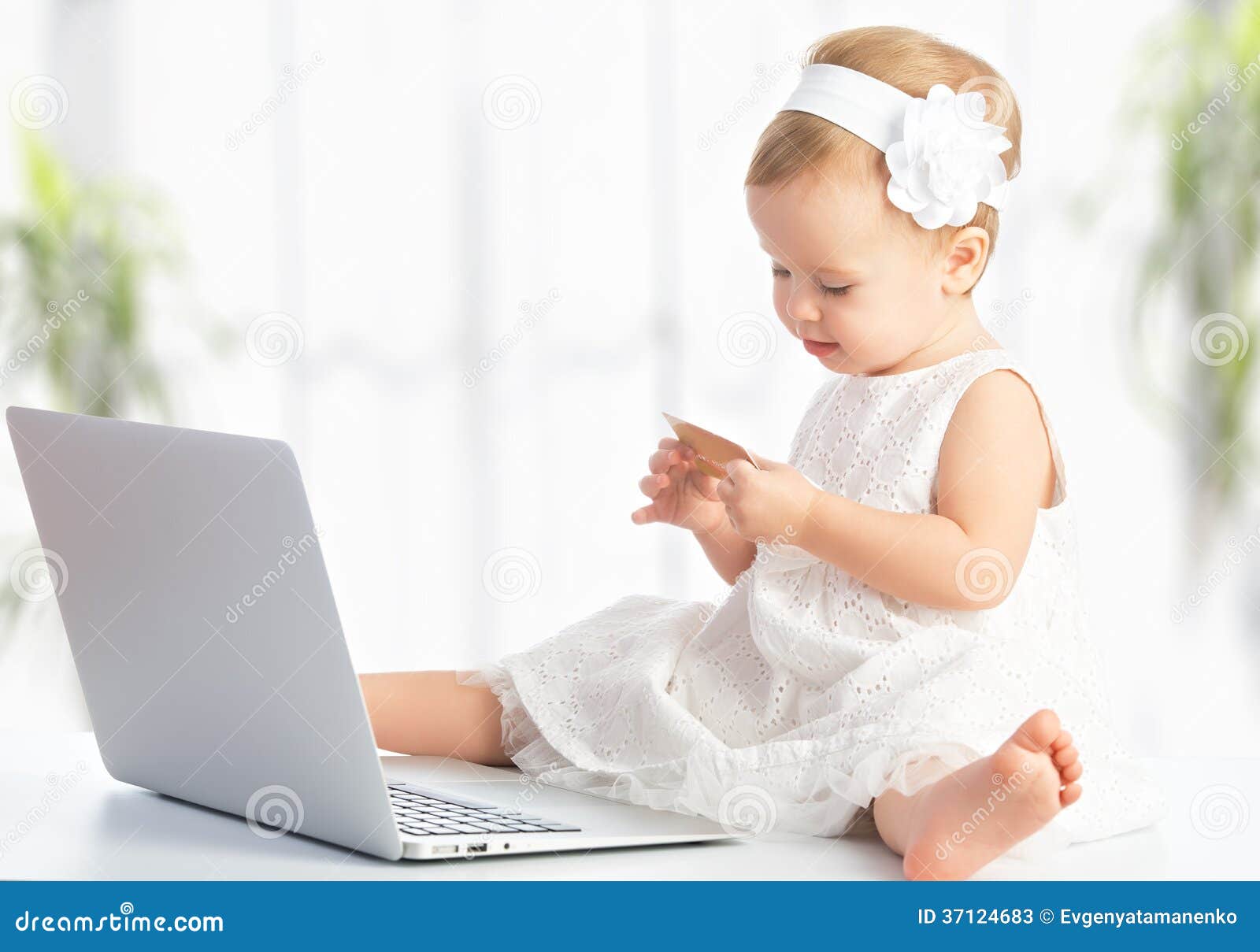 Baby Girl With Laptop And Credit Card Shopping On Internet Stock Photos  Image: 37124683