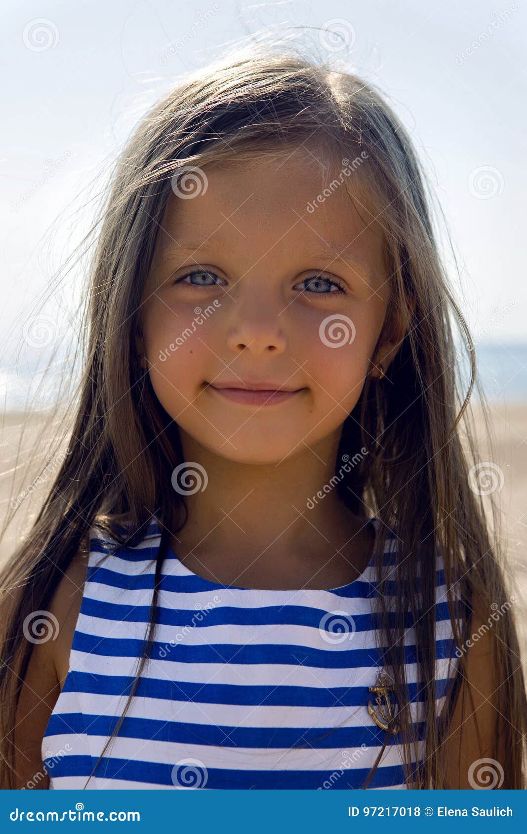 Baby Girl With Long Hair In Striped Blue Dress Stock Photo Image