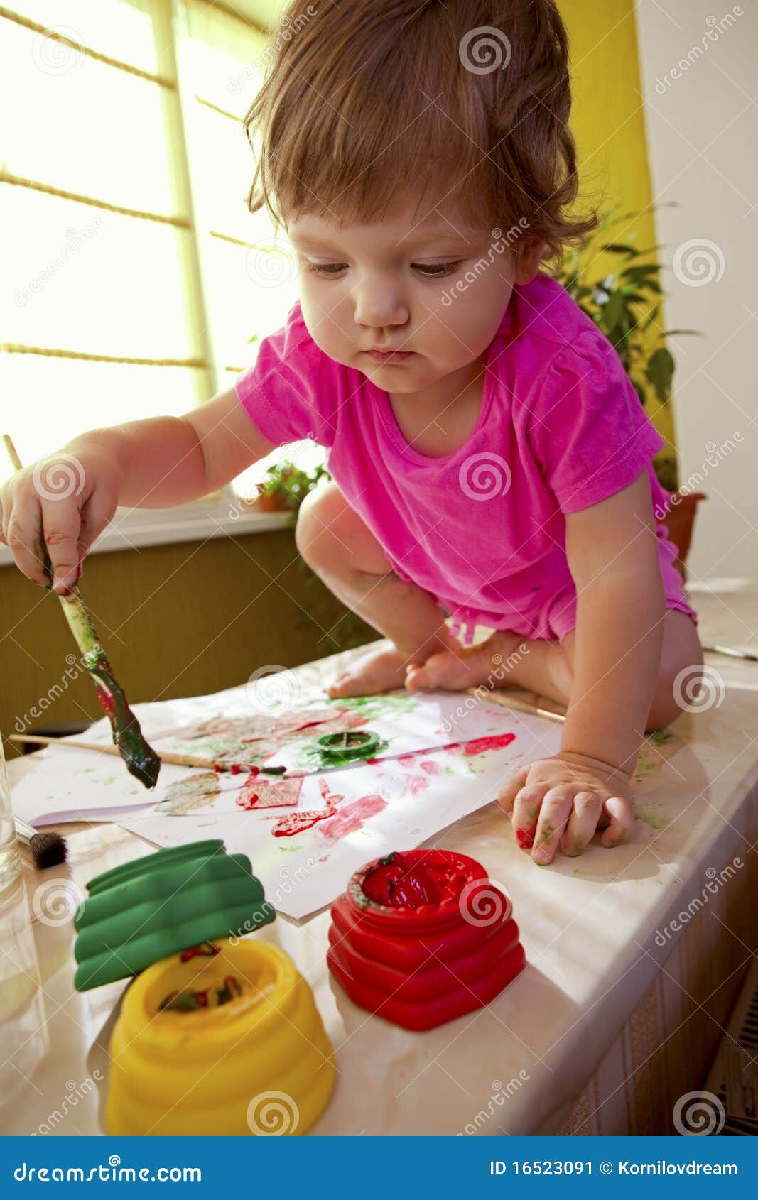 Baby girl with paint brush stock image. Image of colorful 16523091