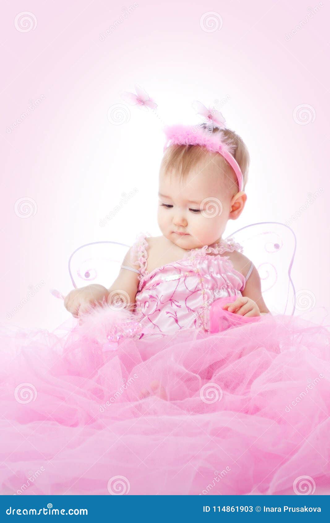 baby in pink dress