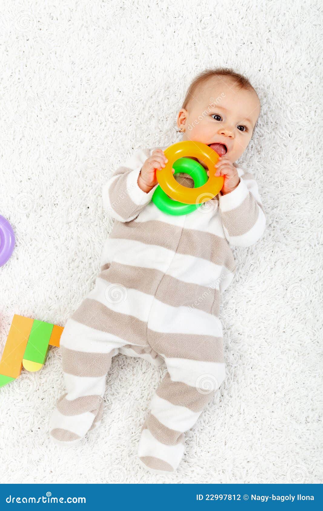 Baby Girl Playing on the Floor Chewing Toys Stock Photo - Image of ...