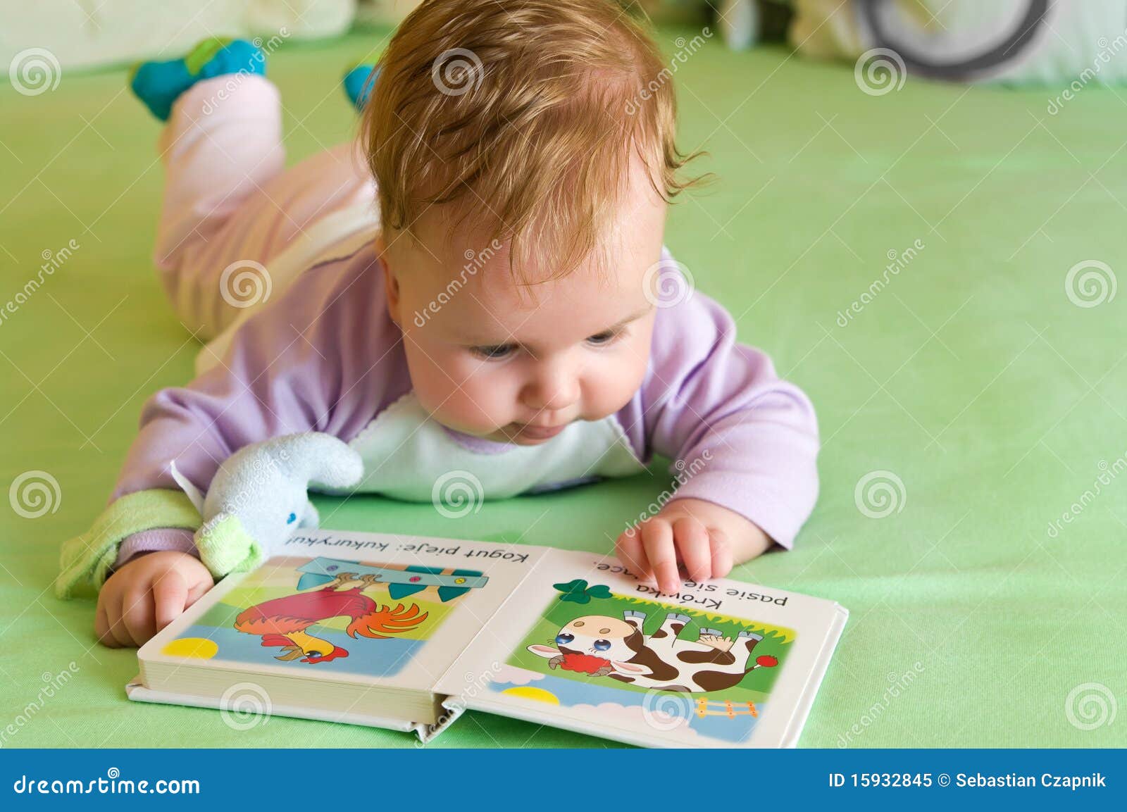 baby girl reading book