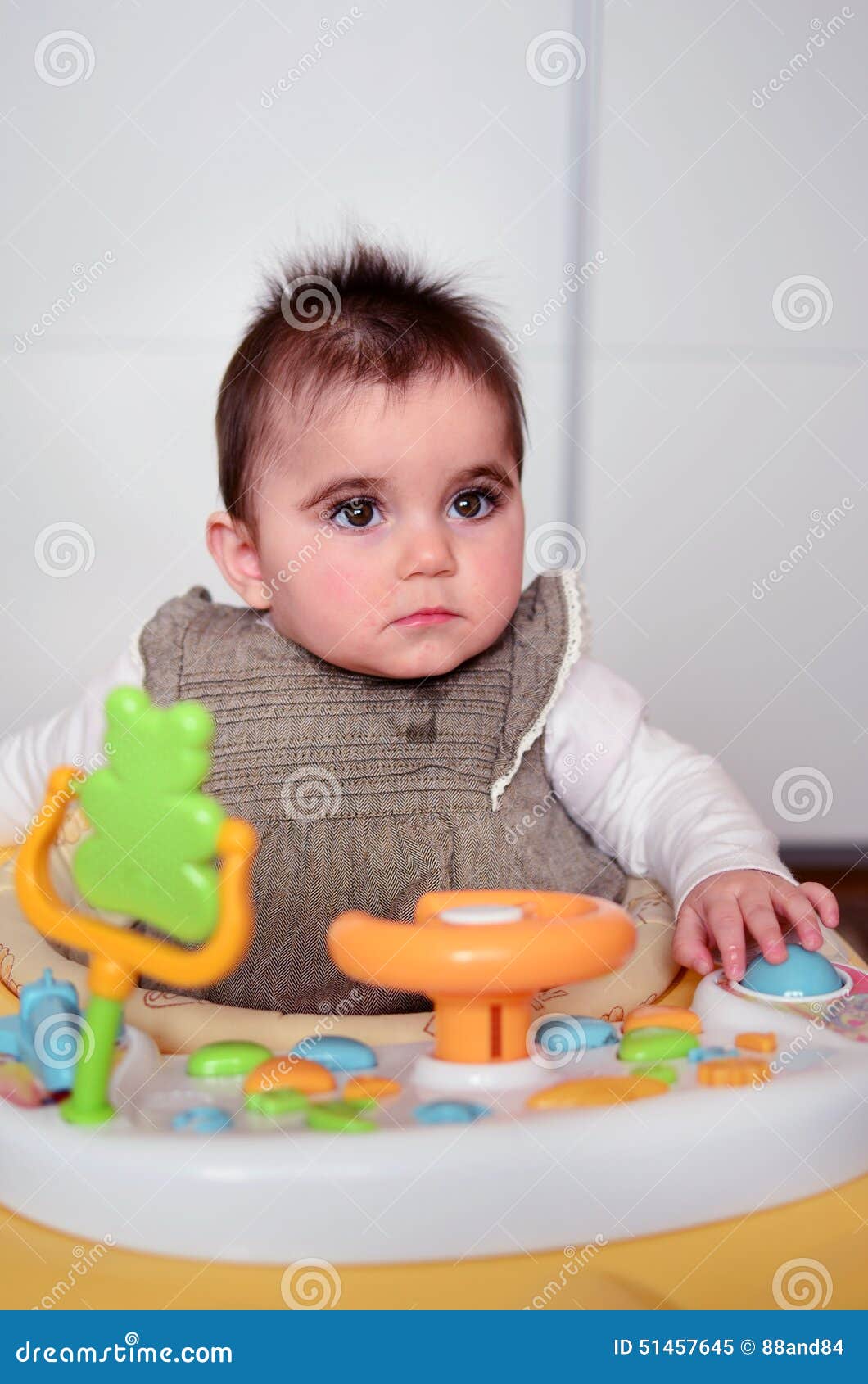Baby girl in a walker. stock image. Image of happiness 51457645