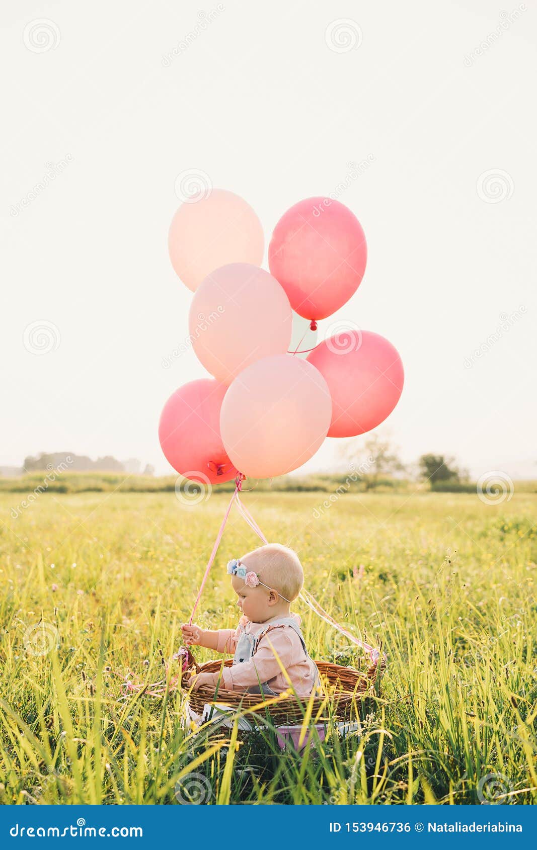 Baby Girl in Wicker Basket with Balloons on Nature at Stock Photo - Image of basket, 153946736