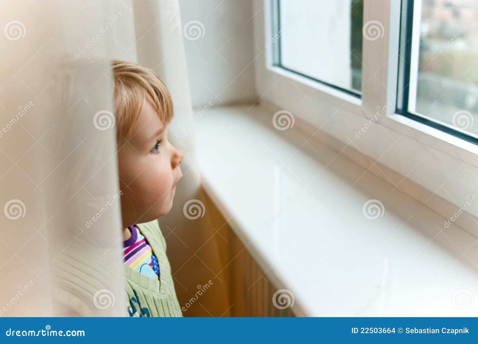 baby girl at window