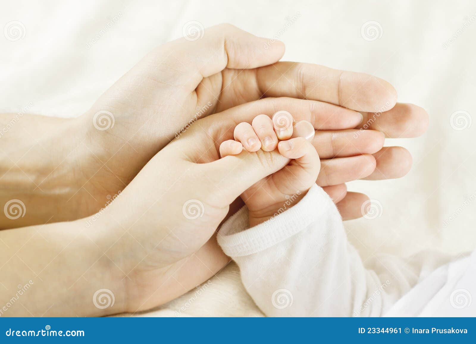 family baby hands. father mother holding newborn kid. child hand