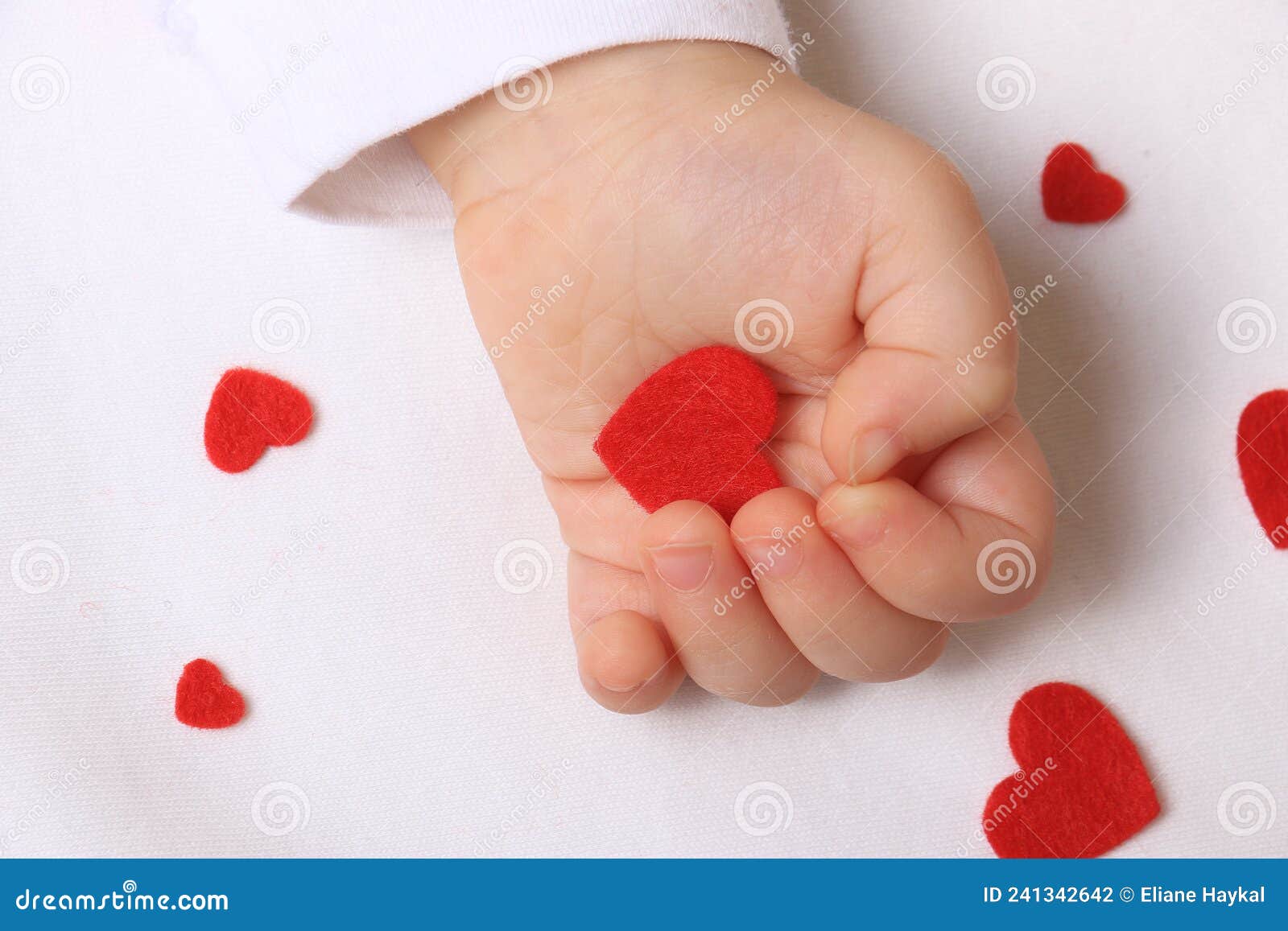 Baby Hand and Red Hearts stock photo. Image of concepts 241342642