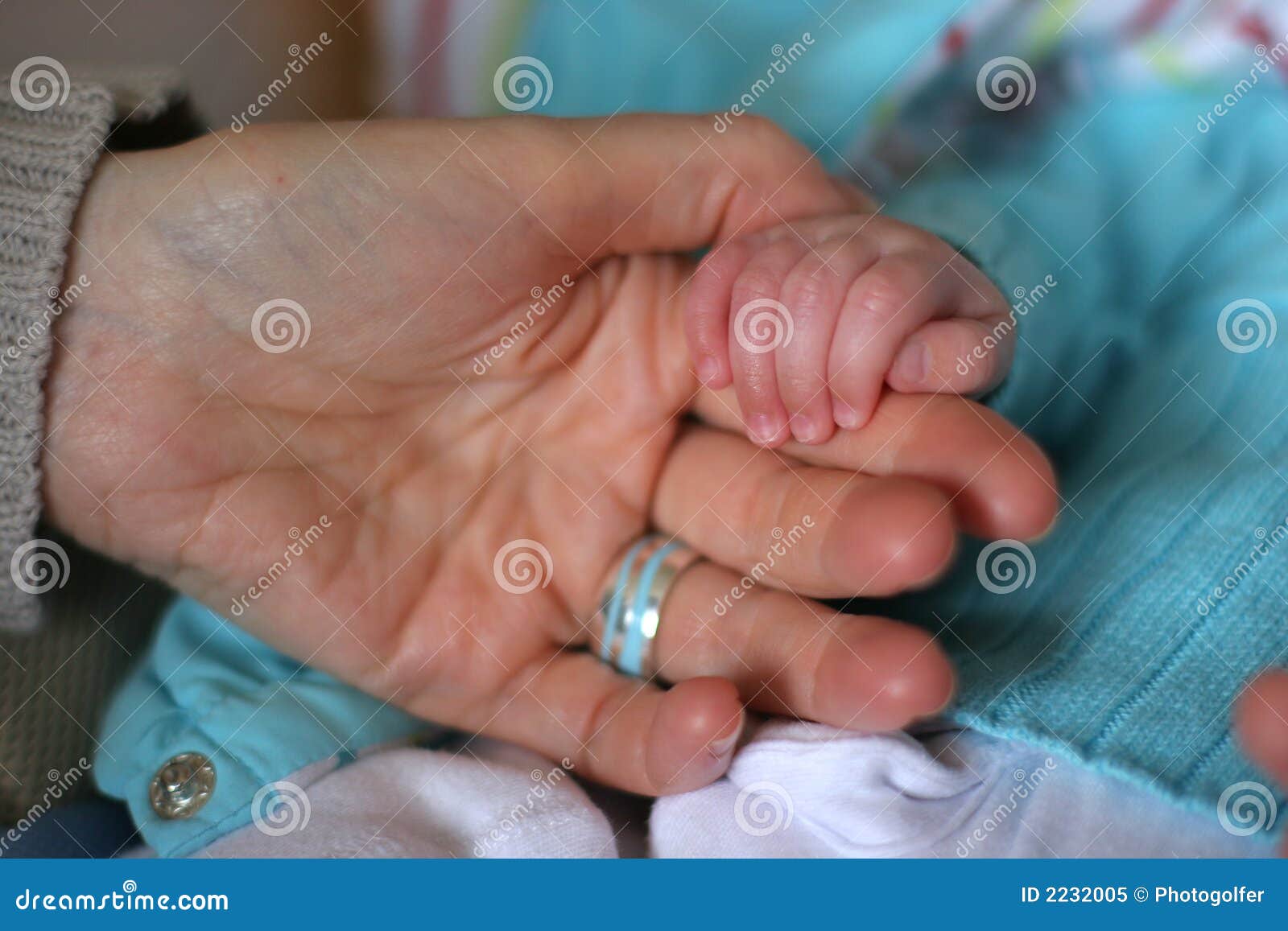 baby hands with father