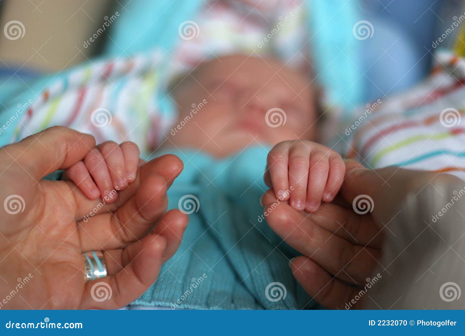 baby hands with father