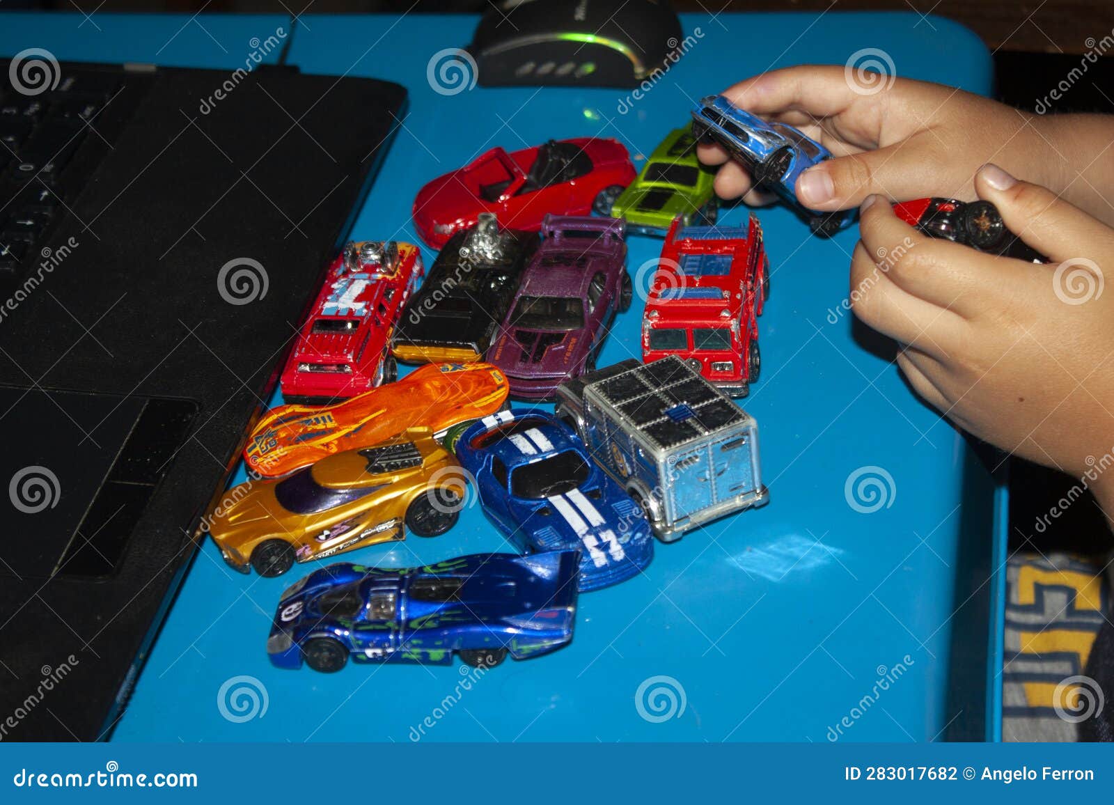 baby hands playing with cars-