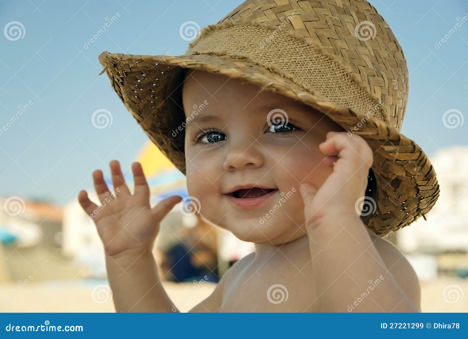 Baby with hat on the beach stock image. Image of face 27221299