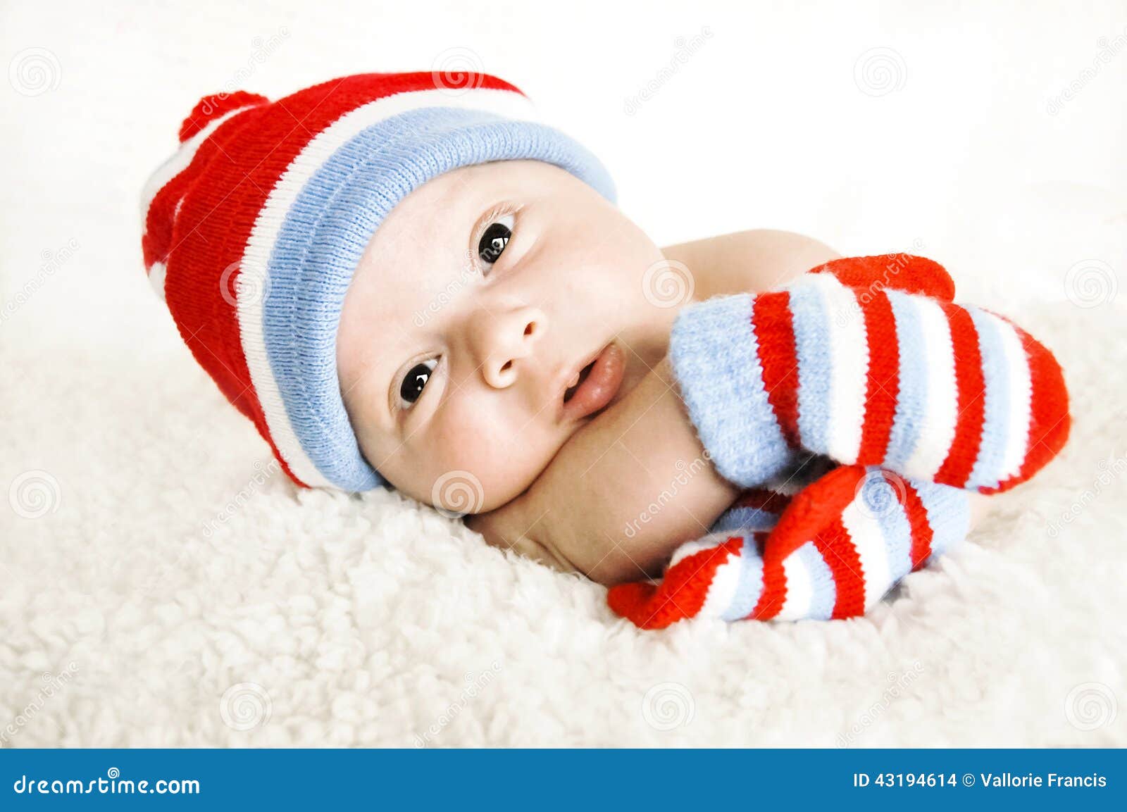 Baby with hat and gloves stock photo. Image of white 43194614