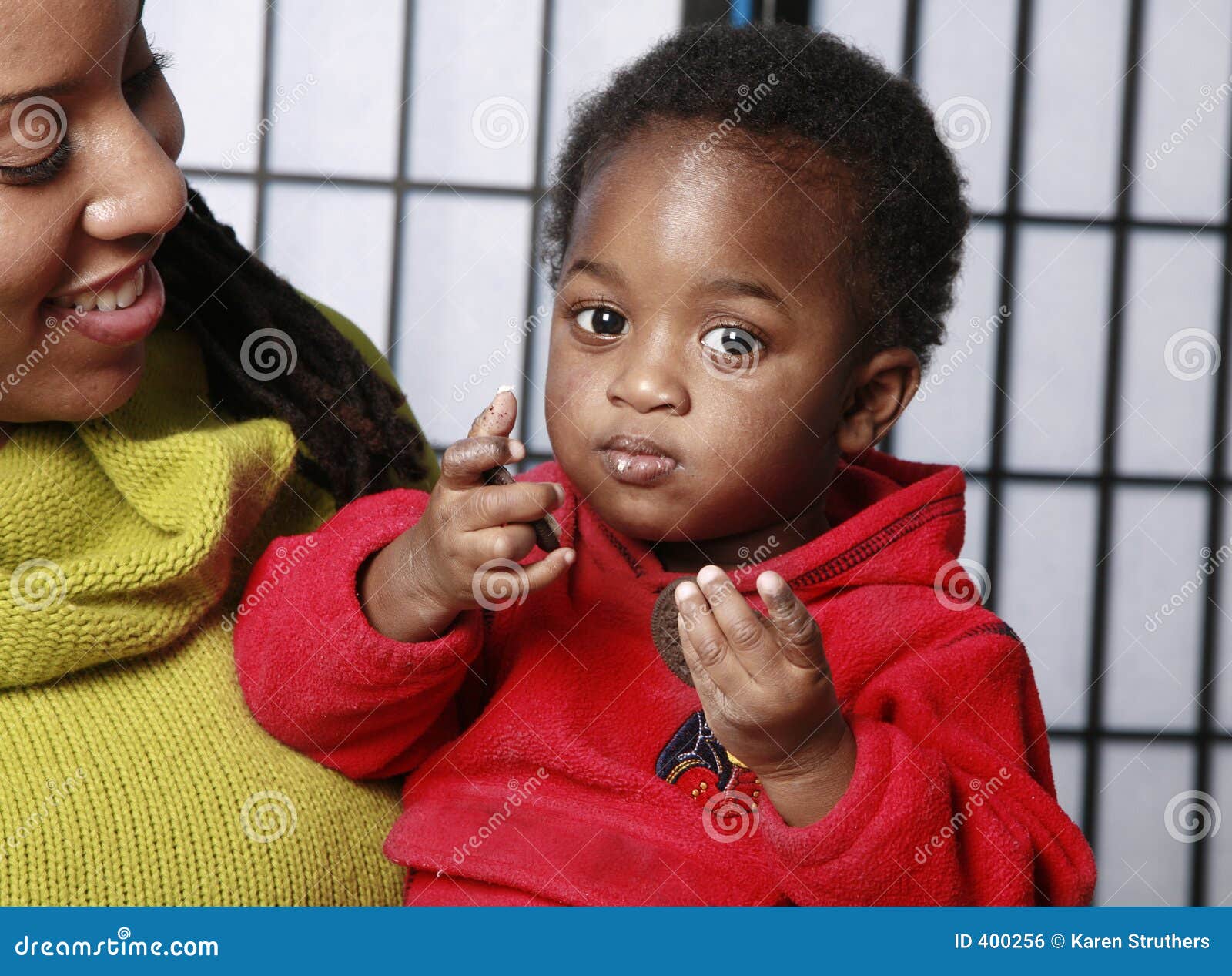Baby in His Mother S Arms Eating Stock Photo Image of care, mother
