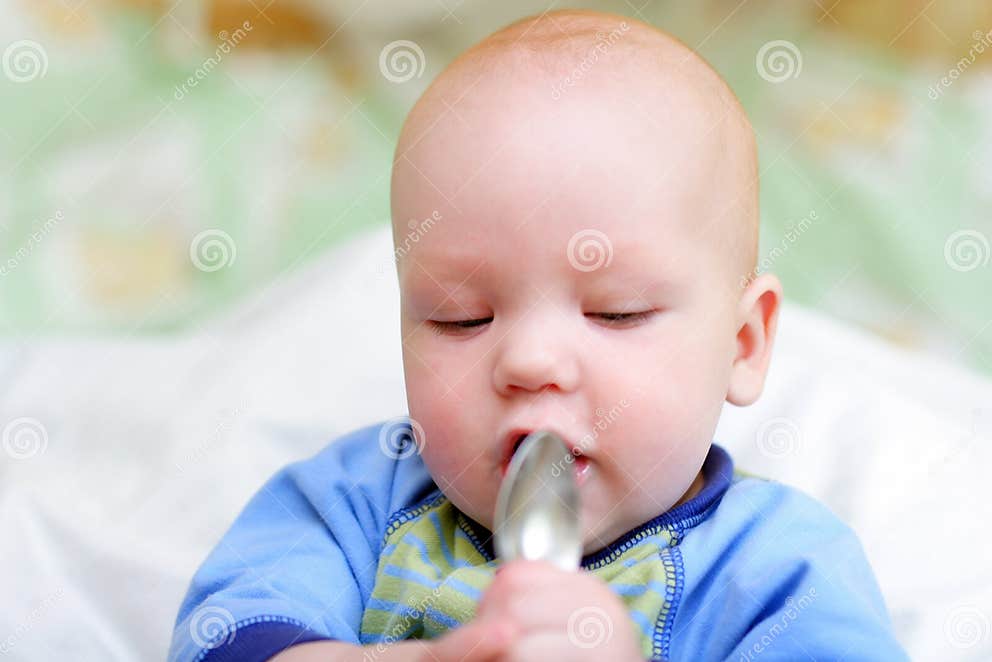 Baby hold spoon stock photo. Image of kids, mixed, eyes 4266928